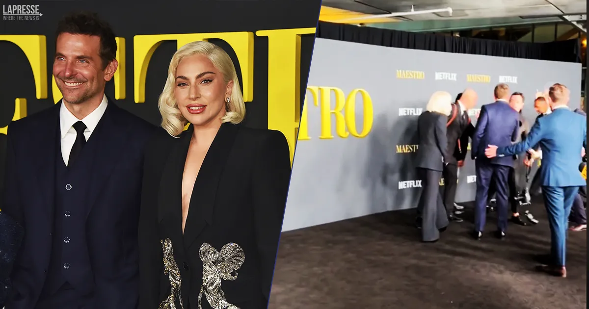 Il fotografo cade di schiena sul red carpet Lady Gaga e Bradley Cooper non esitano nellaiutarlo