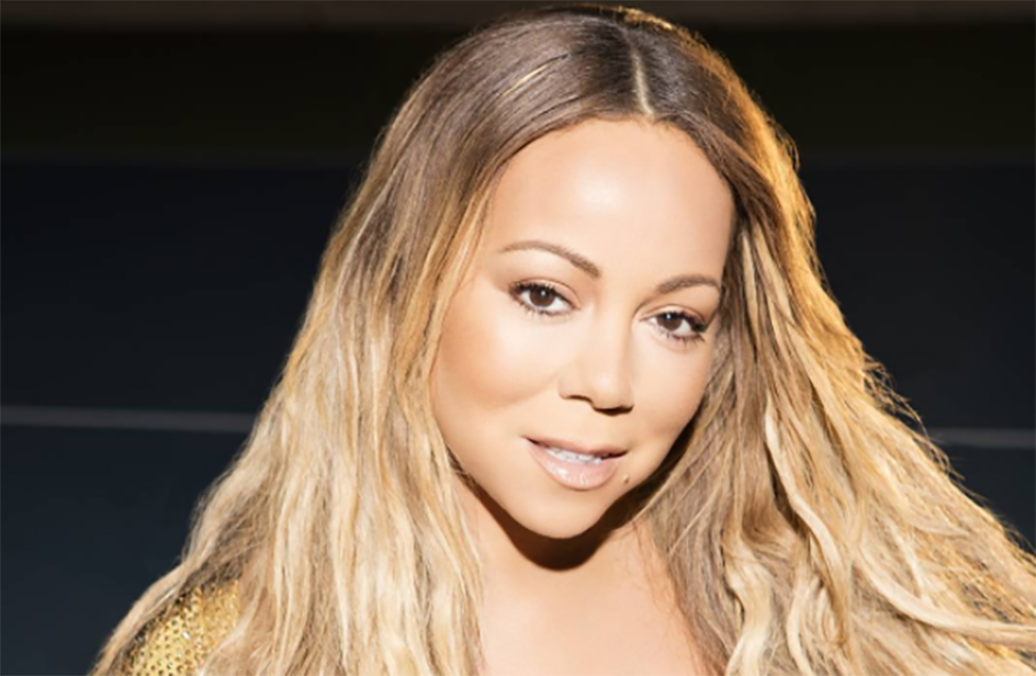 Mariah Carey strizzata in un tubino nero in pelle non riesce a camminare
